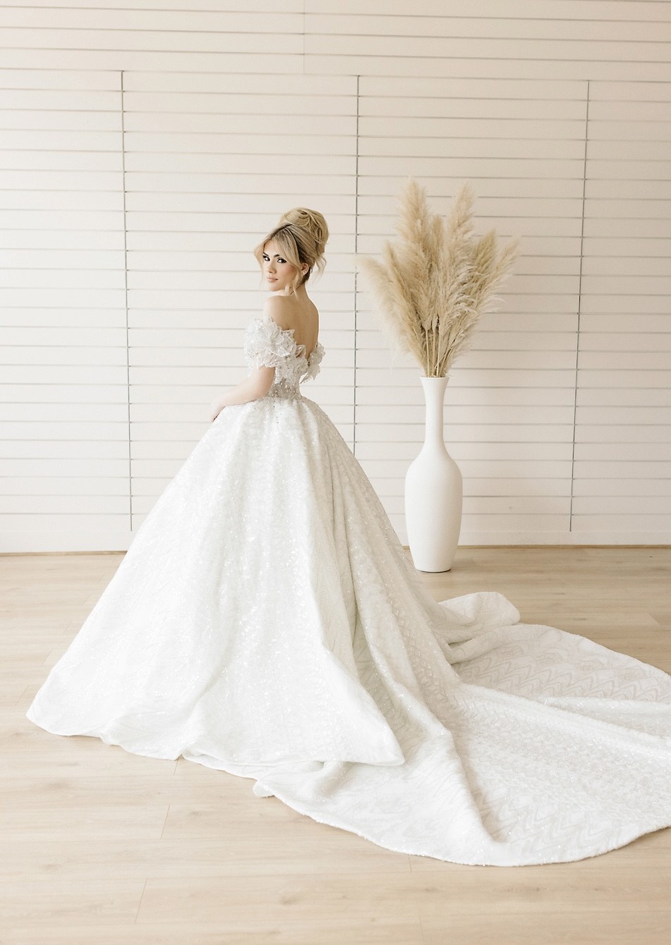 Bride in a dramatic white gown with full train